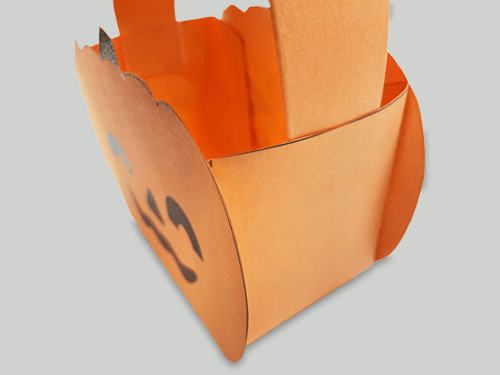 Stick a construction paper strip to the basket as a handle.